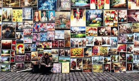 Colorful collection of urban art and photographs on a city wall for visual inspiration.