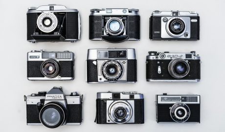 Collection of nine classic film cameras showcasing retro design and craftsmanship.